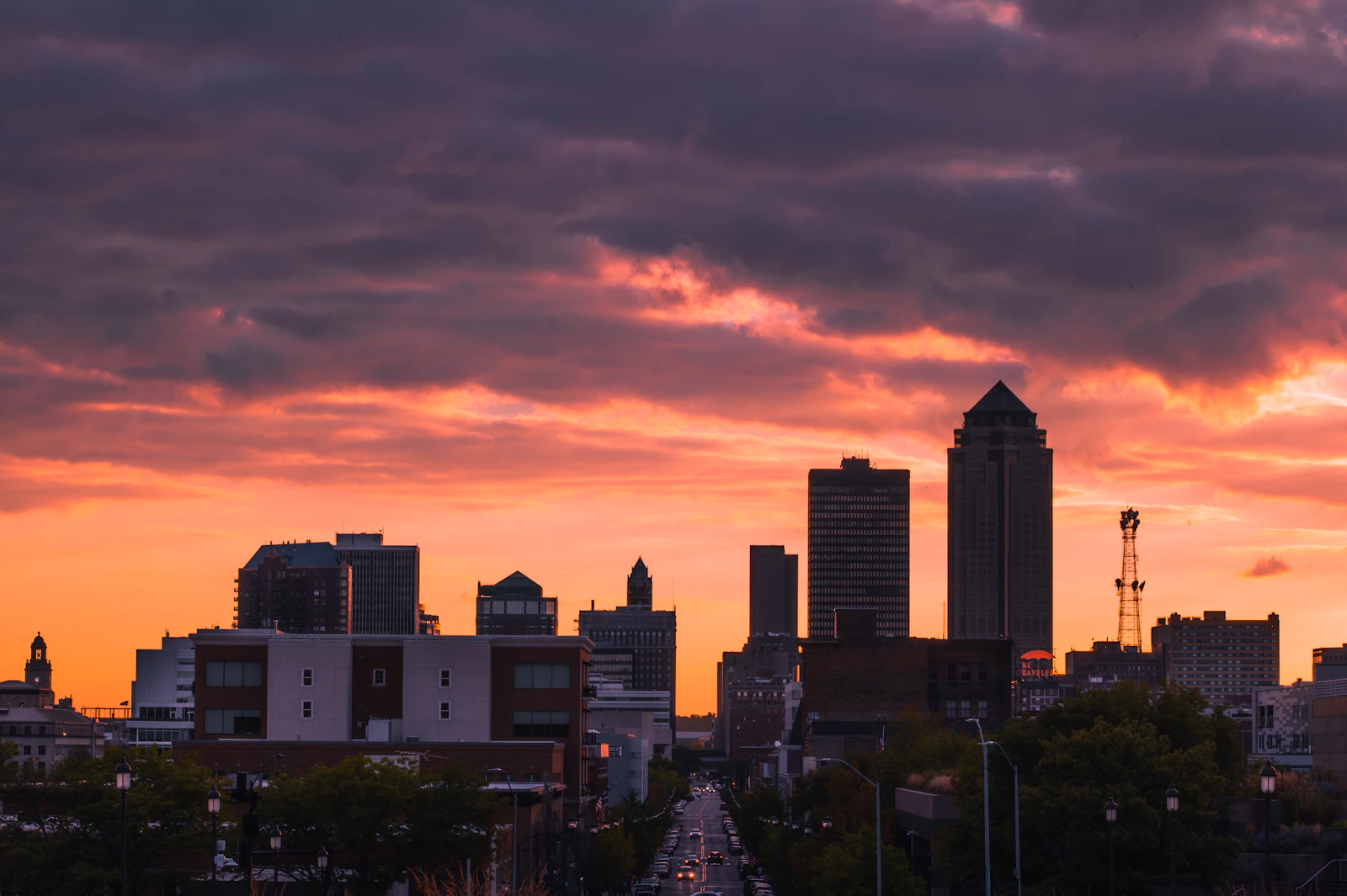 Des Moines skyline and downtown street at sunset in Iowa